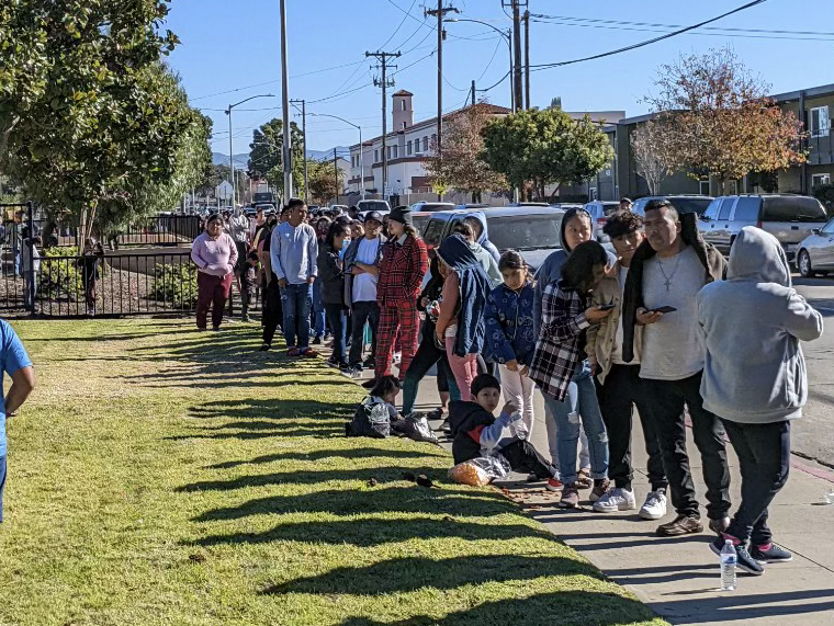 December 21, 2022 Essential farmworkers wait in line at the Santa Maria, CA Center for Employment Training location, one of the many La Cooperativa member agencies administering the $600 payments to qualifying farmworkers on behalf of the USDA.